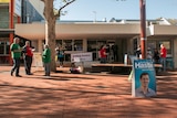 Party supporters hand out how-to-votes at Armadale's pre-polling station.