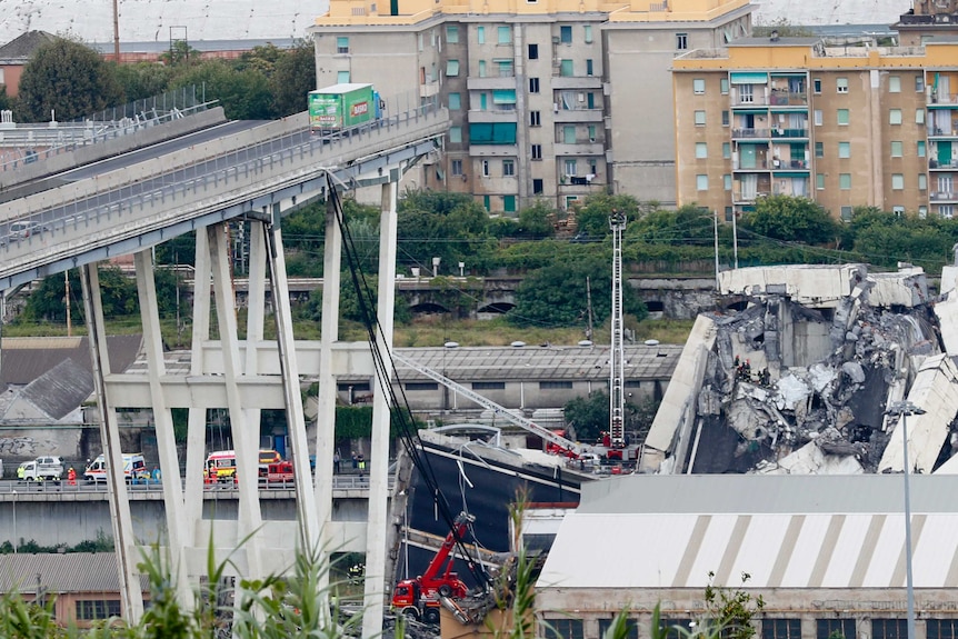 A wide shot shows a truck stopped right before a collapsed part of a bridge.