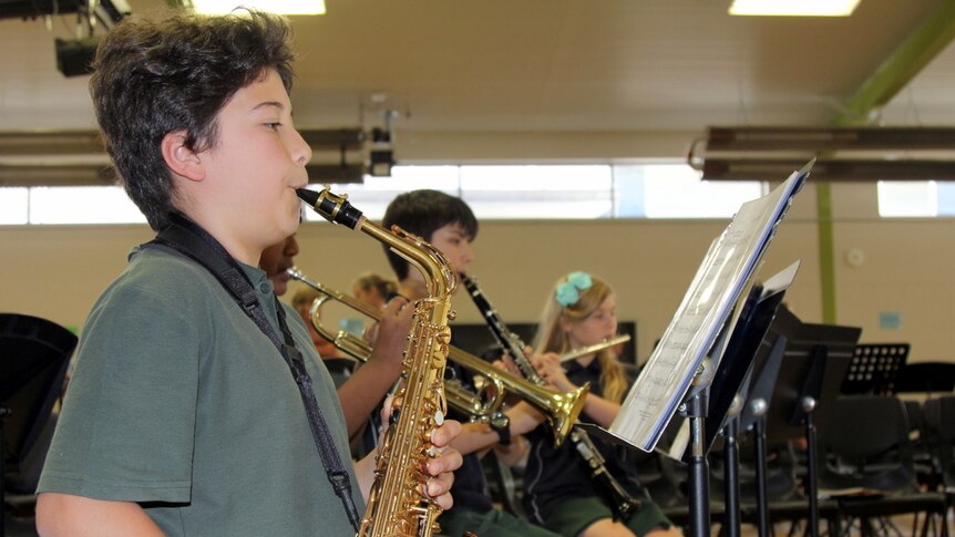 Student plays the saxophone