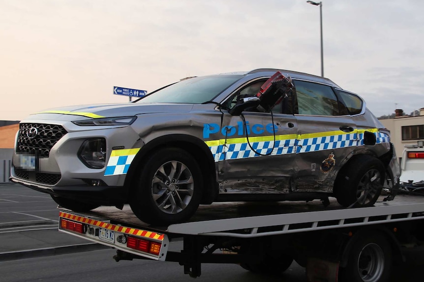 Tasmania Police car damaged in two car crash in which a male pedestrian died, Launceston, January 6, 2019.