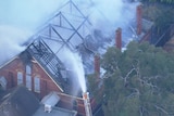 Smoke rises from a burning church