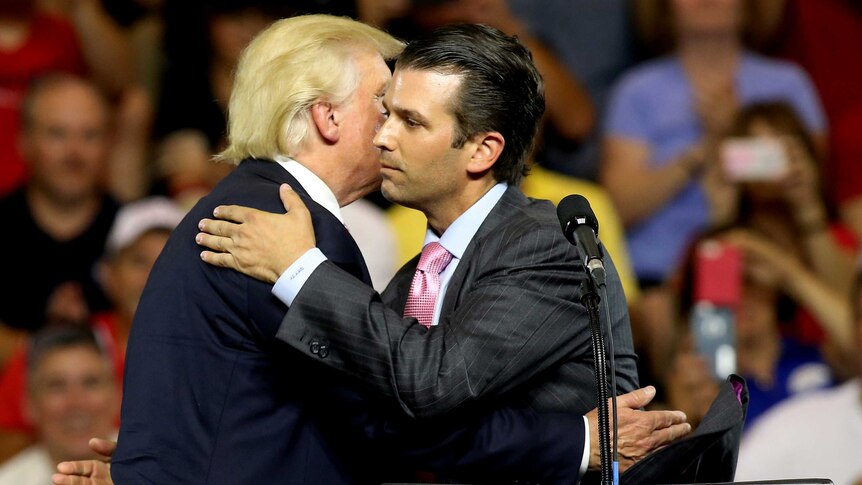 Donald Trump hugs his son Donald Trump Jr at a campaign rally.