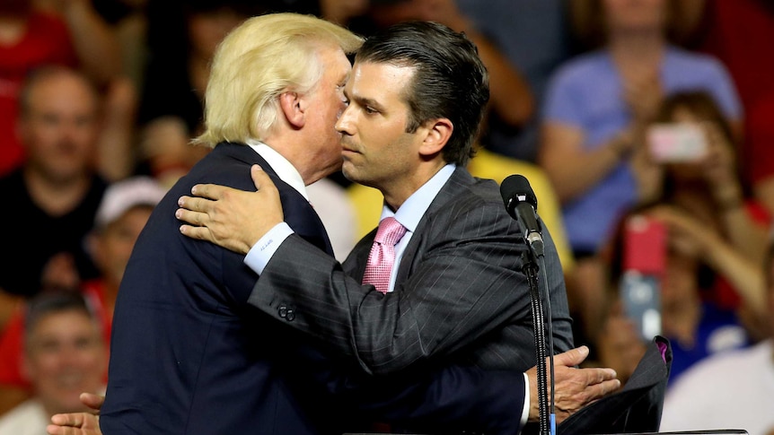 Donald Trump hugs his son Donald Trump Jr at a campaign rally.