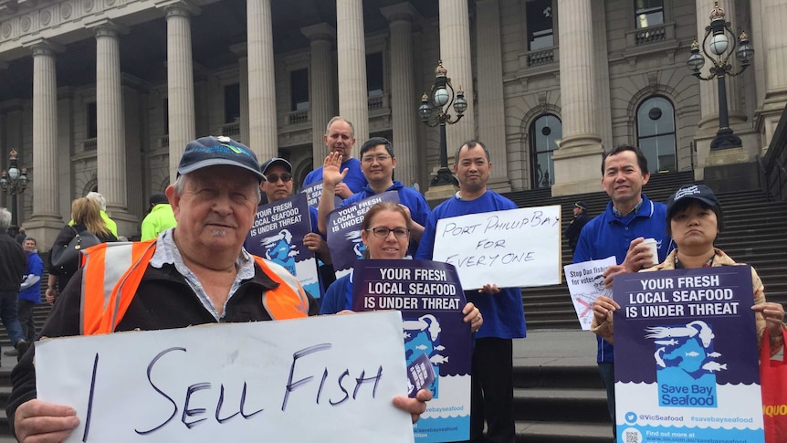 A group of fishers, retailers and chefs protest outside State Parliament