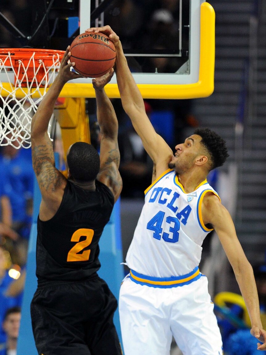 UCLA's Jonah Bolden blocks shot by Arizona State's Willie Atwood in Los Angeles on January 9, 2016.