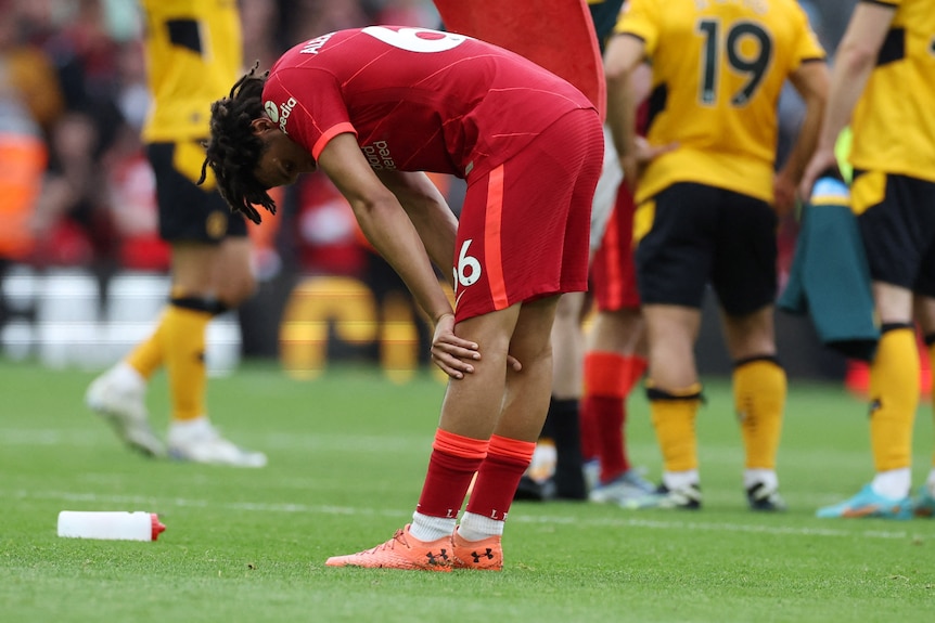 Liverpool's Trent Alexander-Arnold hunches over on the final day of EPL action.