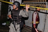 Indonesian police guard the crime scene of the shooting of alleged terrorist suspects in Bali