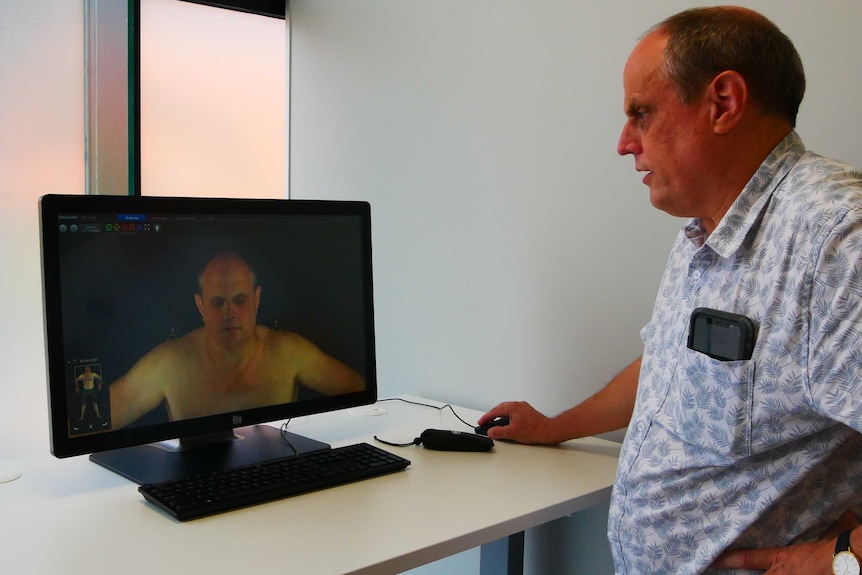 Dr John Evans views a high-resolution image taken of himself, a 3D icon that makes tele-health much easier.