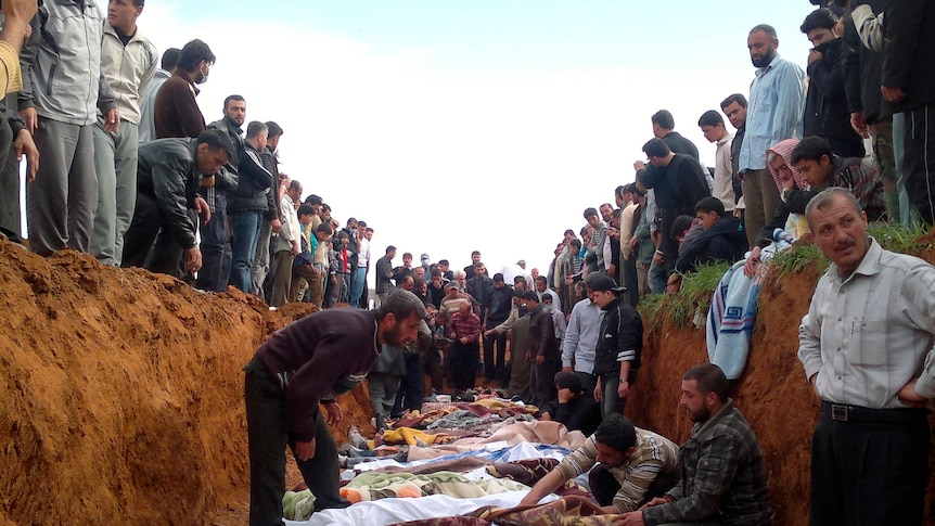 A supplied photo shows Syrians mourning men whom activists say were killed by the government army on April 5.