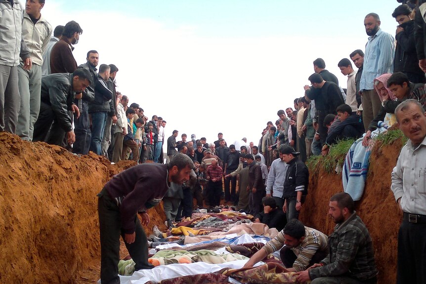 A supplied photo shows Syrians mourning men whom activists say were killed by the government army on April 5.