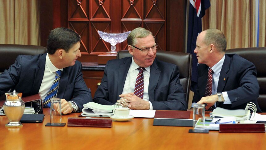 Mr Newman (left) talks to Mr Seeney (centre) and Mr Springborg during the first cabinet meeting.