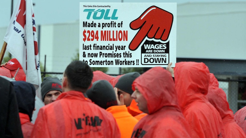 Striking workers picket at the Coles warehouse in Somerton