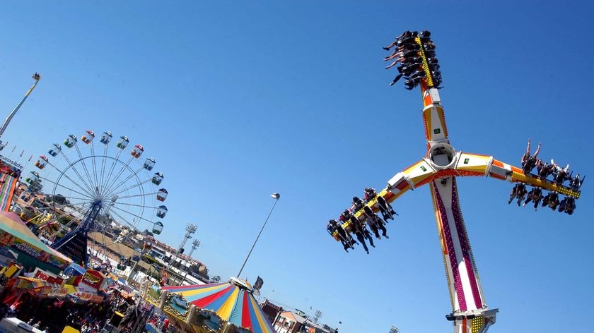 Ekka-goers get their thrills on one of the sideshow alley rides