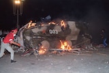 An armoured personnel in flames as students set it on fire near Tiananmen Square in Beijing.