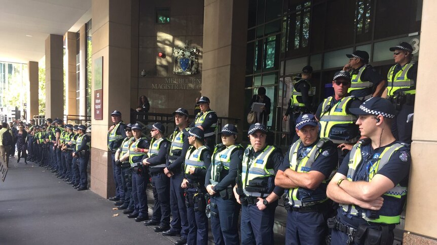 Anti-fascist protesters rally outside Melbourne Magistrates Court