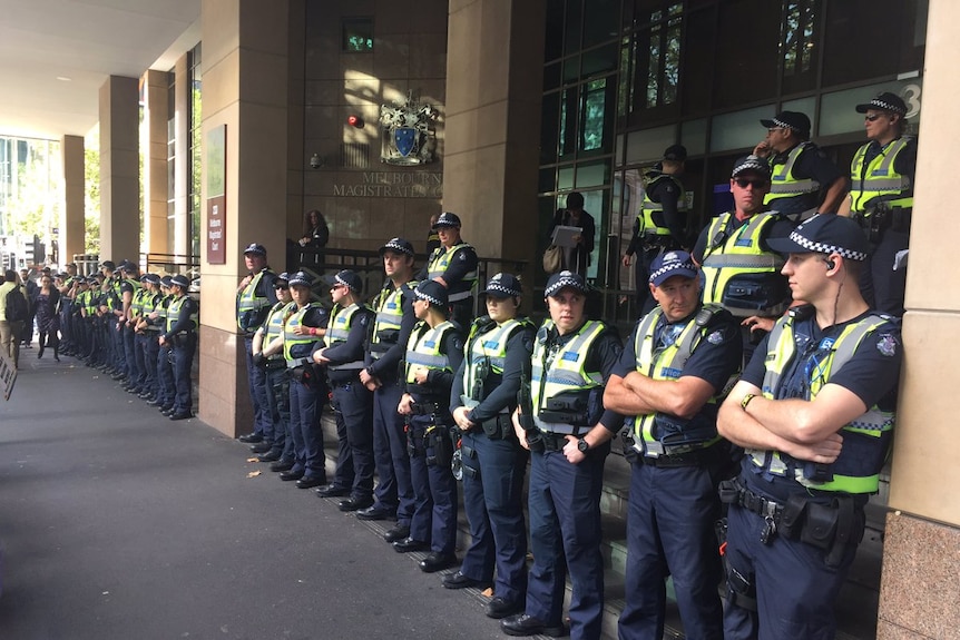 Anti-fascist protesters rally outside Melbourne Magistrates Court