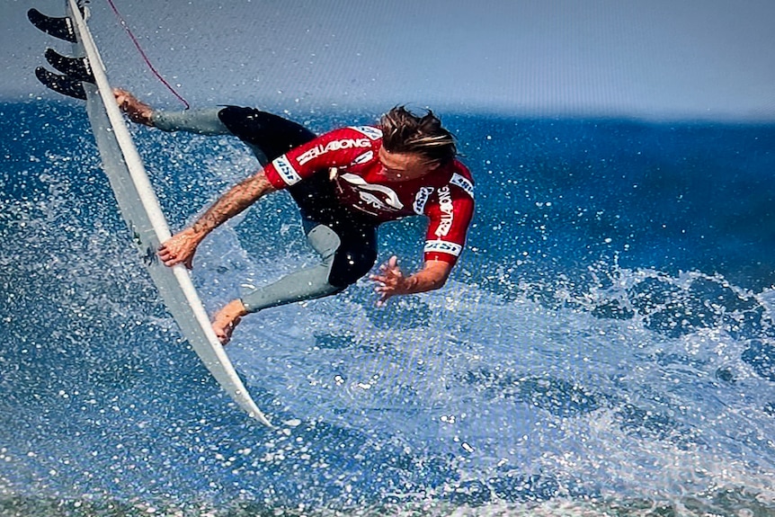 Chris Davidson surfing