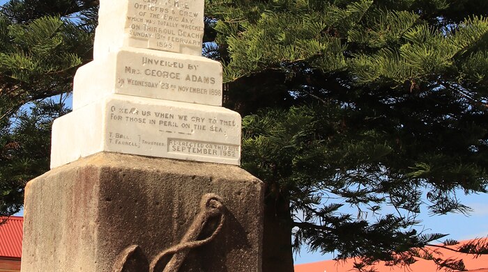 The Amy monument in the Thirroul beach car park on a sunny day.