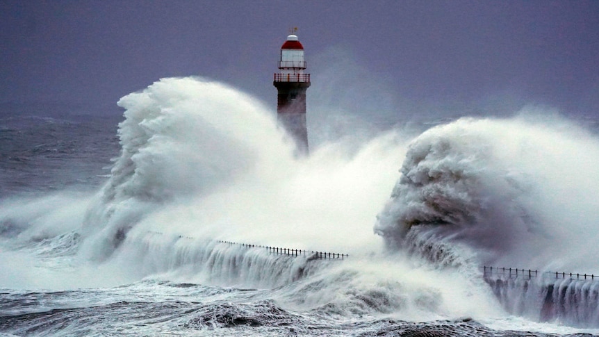 Waves crash over the Roker lighthouse