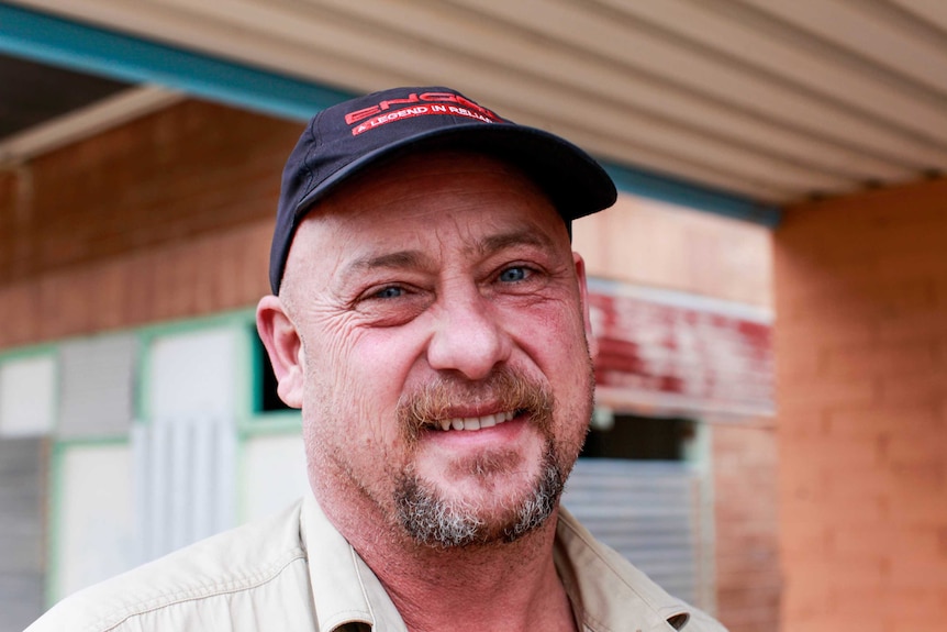 Man wears a baseball cap