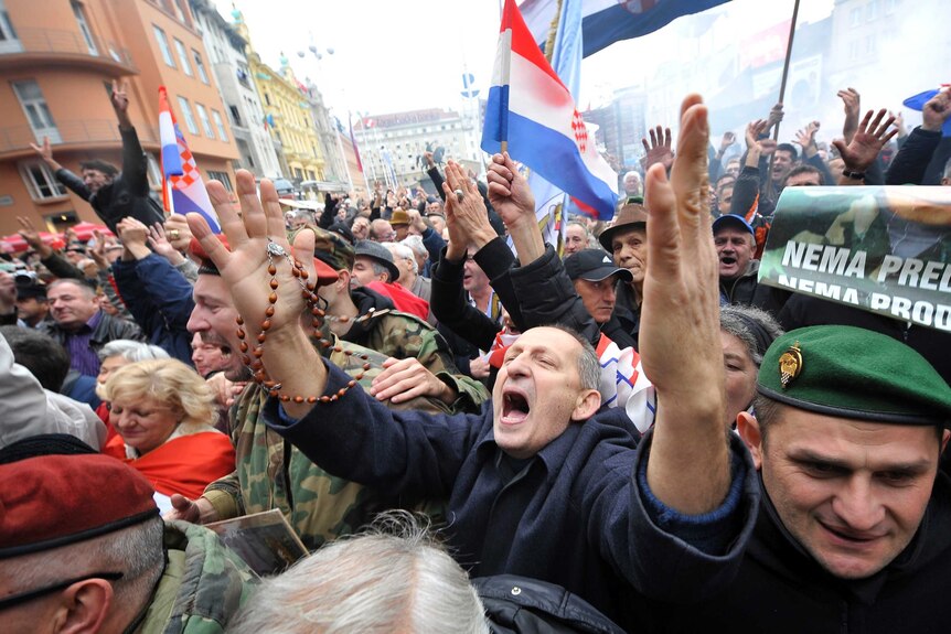 Crowds in the Croatian capital Zagreb cheer after hearing two former generals had been acquitted of war crimes.