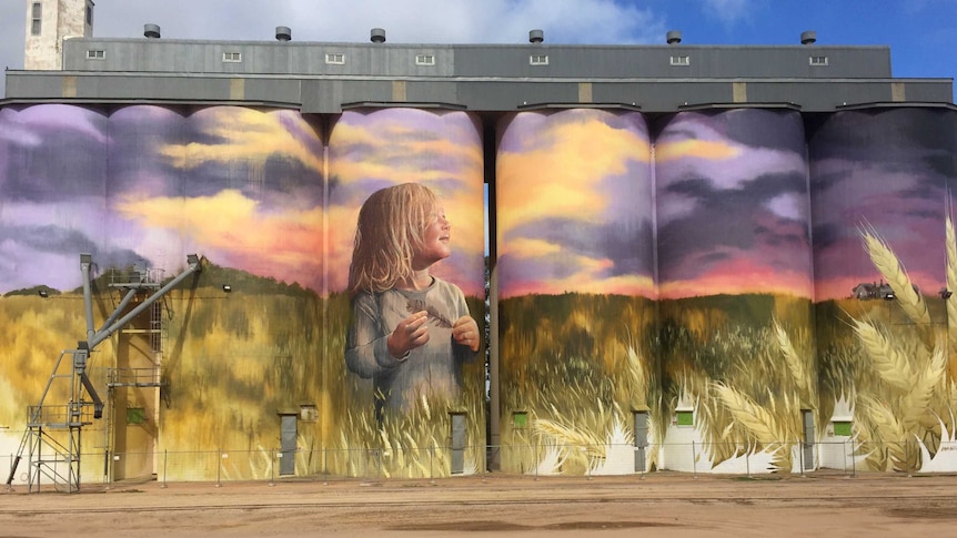 A row of decorated silos.