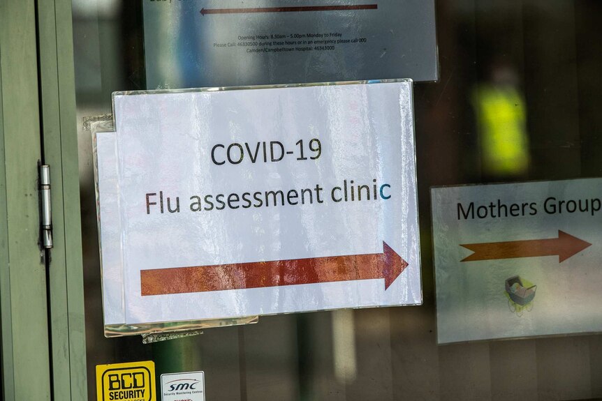 A sign that reads COVID-19 Flu assessment clinic.