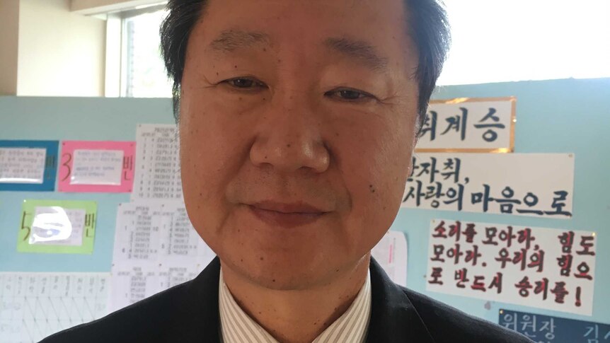 A close-up headshot of Kim Seng-fa, the dean of studies at a North Korean School in the Japan.