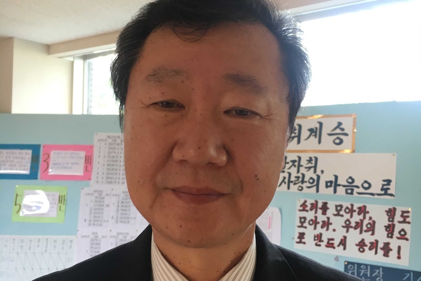 A close-up headshot of Kim Seng-fa, the dean of studies at a North Korean School in the Japan.