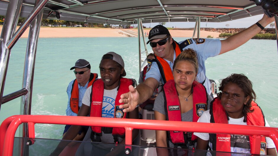 Lyle Smedley from Broome Volunteer Sea Rescue directs Francis Yagan in how to drive the rescue boat.