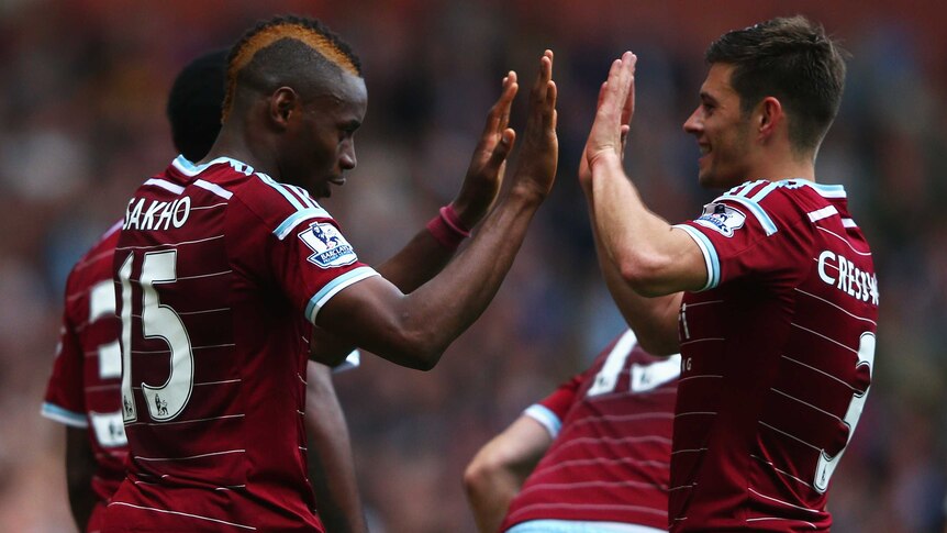 Diafra Sakho and Aaron Cresswell celebrate a West ham goal