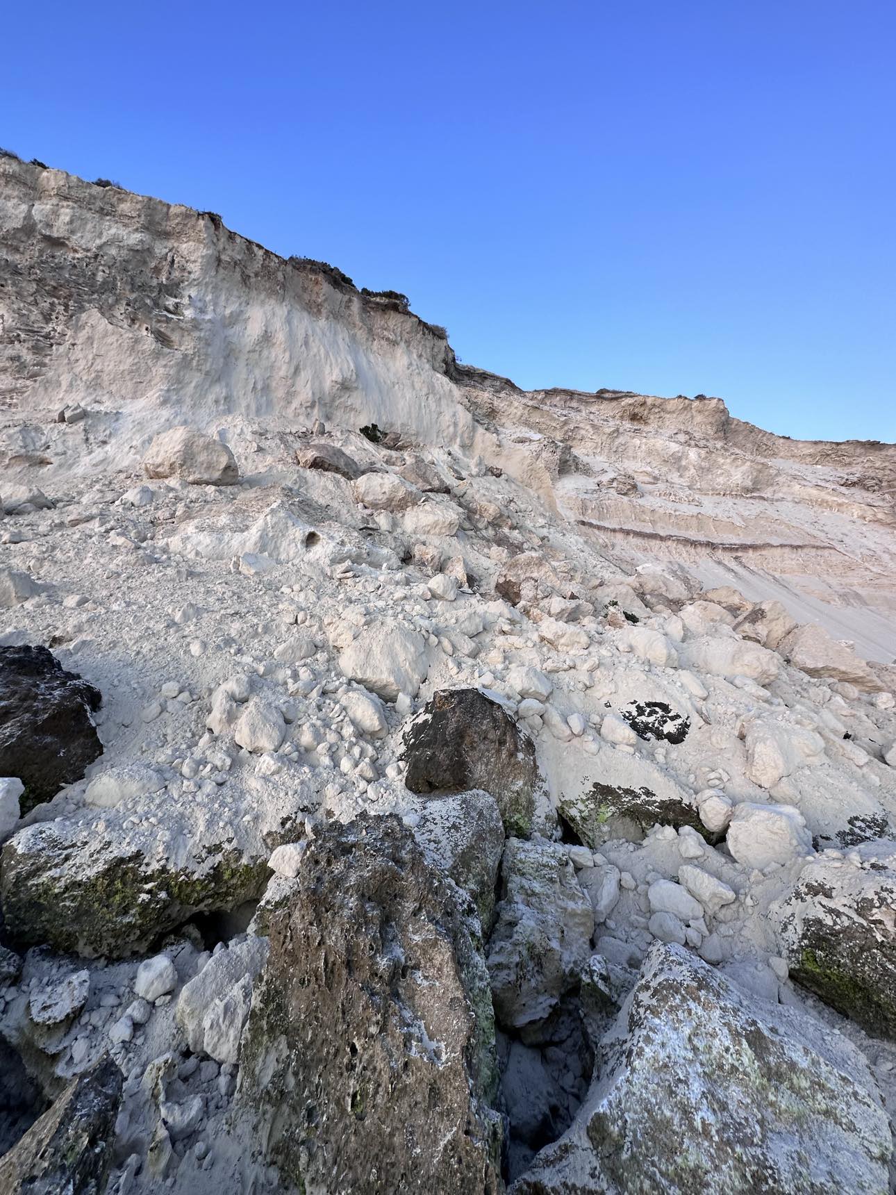 A large pile of white-sandy coloured rock.