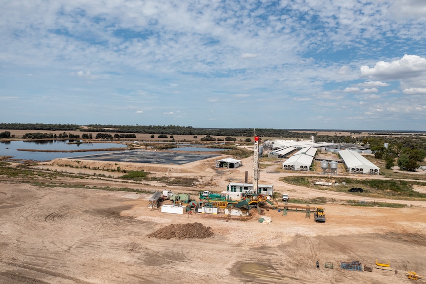 Aerial photo of a piggery with a water bore drill rig in the foreground, near Moonie, February 2023