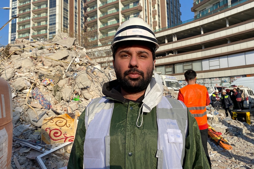 A young bearded man in a hard hat 