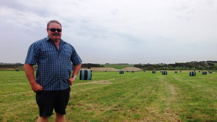 Inverloch dairy farmer Warren Redmond in a paddock recently cut for silage on a property he leases in South Gippsland.