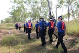 Police search the rural area outside of Darwin