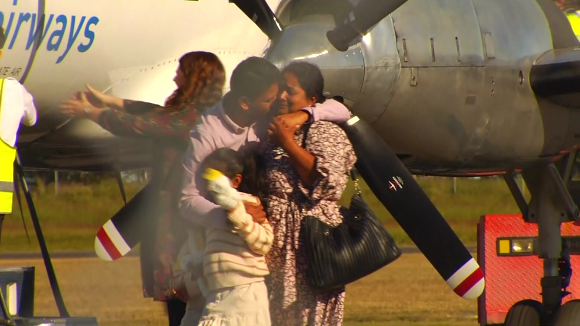 The Nadesalingam family landing back in Biloela