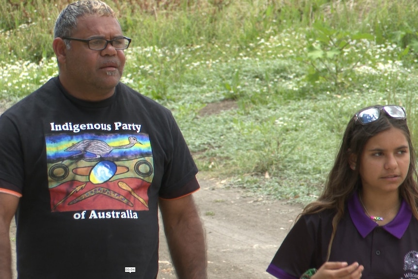 Owen and Amelia Whyman walking down by the Darling-Barka River in Wilcannia. 