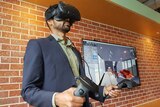 Ray Singh uses VR headset