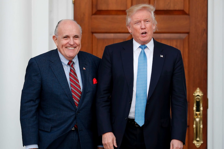 Donald Trump, right, stands next to Rudy Giuliani.