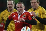 Wallabies in his wake... Keith Earls of Munster chases down a loose ball at Thomond Park