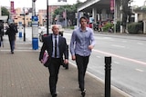Tennis player Isaac Frost (R) leaves the Brisbane Magistrates Court with a lawyer on June 14, 2017.