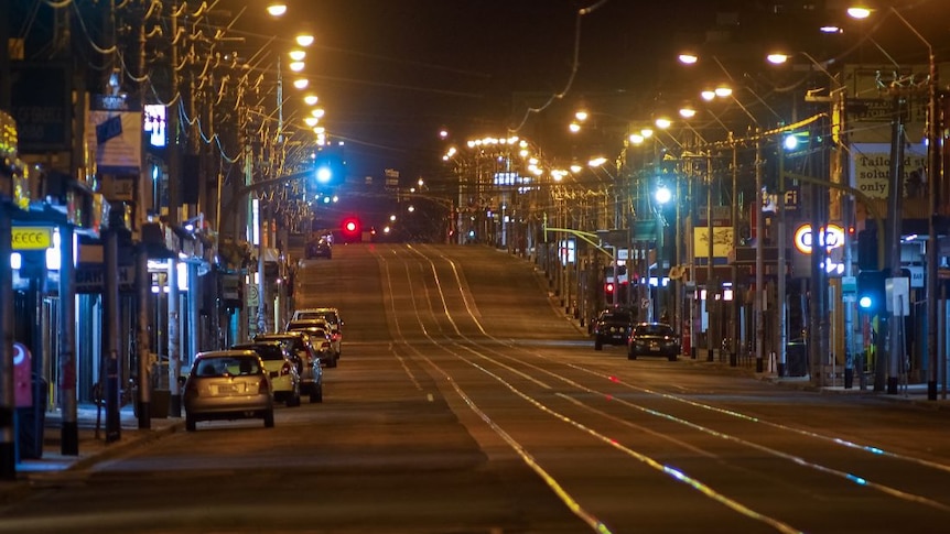 An empty street at night during Melbourne's coronavirus curfew.