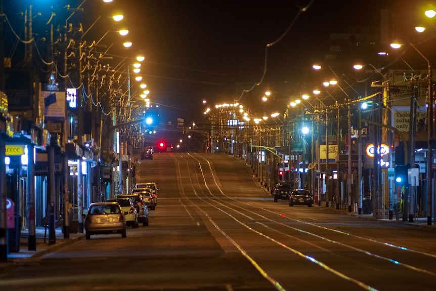 An empty street at night during Melbourne's coronavirus curfew.