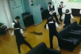 Python falls through roof during staff meeting at China bank