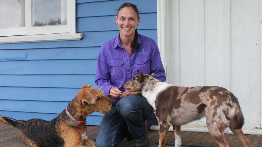 Dr Shey Rogers outside her veterinary practice with her dogs Delilah (left) and Vera (right).