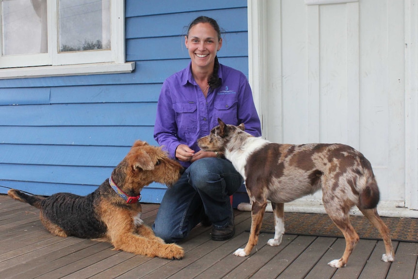 Dr Shey Rogers outside her veterinary practice with her dogs Delilah (left) and Vera (right).