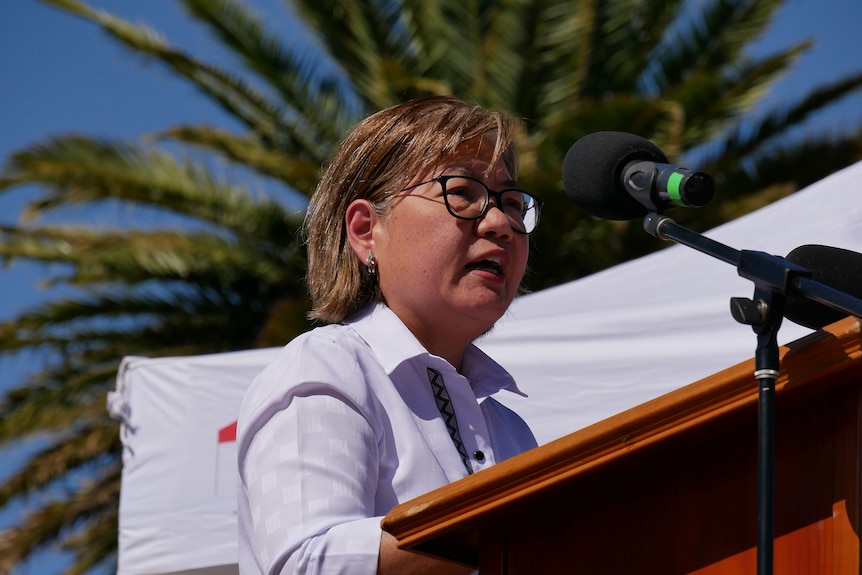 woman speaking at a podium