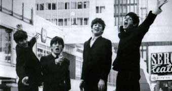 The Beatles jumping for a photo in Stockholm in 1963