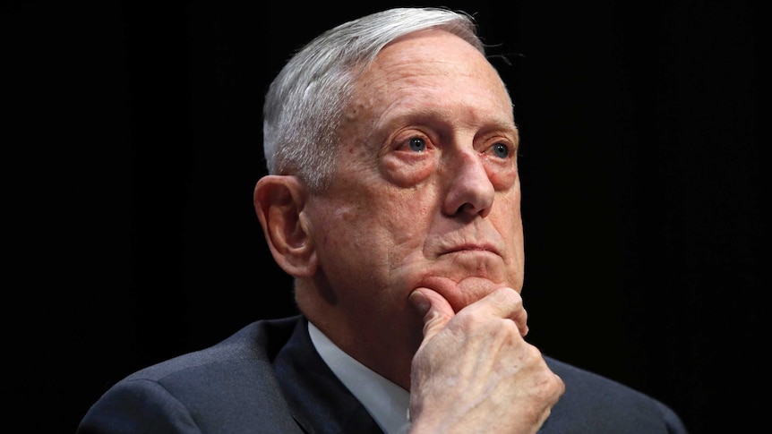 James Mattis sits with hand holding chin, looking outwards.